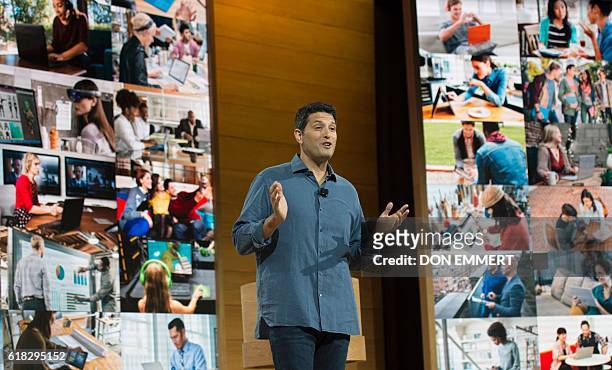 Microsoft executive Terry Myerson speaks at a Microsoft news conference to unveil updated versions of its the Surface Book and the Surface Pro 4...