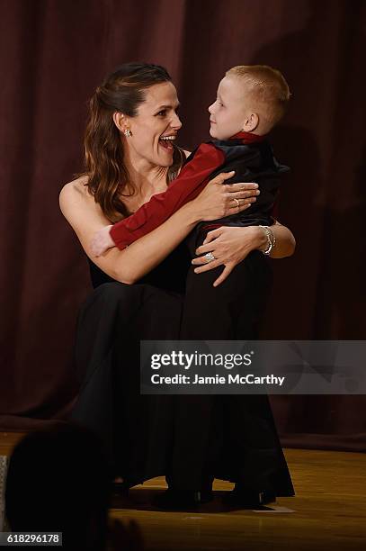 Host, Actress and Save the Children Trustee Jennifer Garner and Early Steps Program Participant Brantley Smith embrace onstage at the 4th Annual Save...