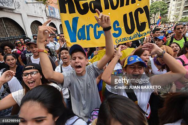 University students march against the government of Venezuelan President Nicolas Maduro in the streets of Caracas on October 26, 2016. Venezuela's...
