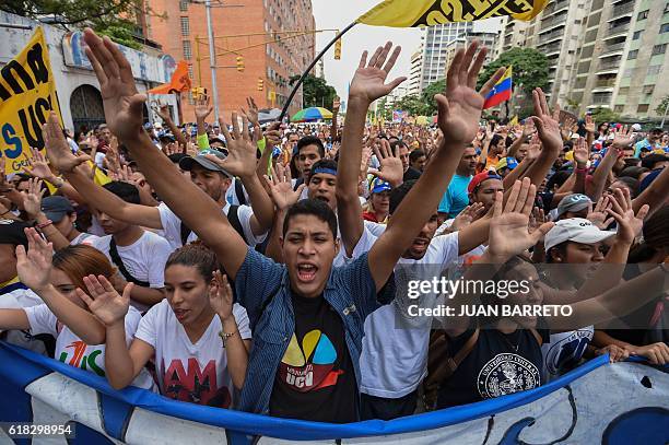 University students march against the government of Venezuelan President Nicolas Maduro in the streets of Caracas on October 26, 2016. Venezuela's...