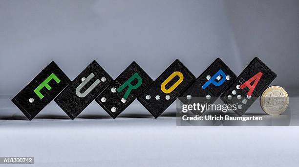 Horror scenario - Symbol photo on the future of Europe and a possible domino effect. The photo shows Domino stones with the lettering Europe and a 1...