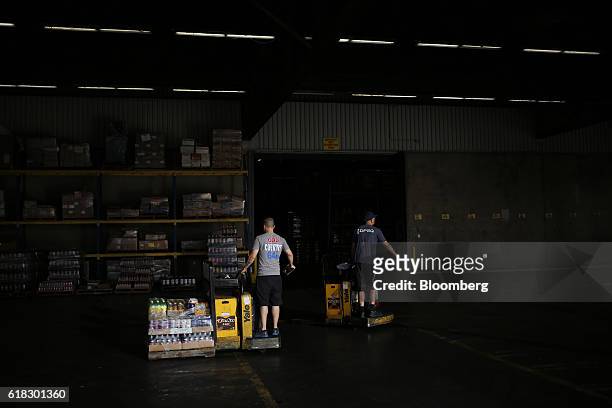 Employees organize delivery orders at the Dr. Pepper Snapple Group Inc. Bottling plant in Irving, Texas, U.S., on Tuesday, Oct. 25, 2016. Dr. Pepper...