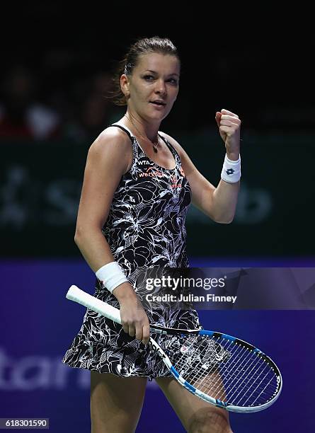 Agnieszka Radwanska of Poland celebrates victory in her singles match against Garbine Muguruza of Spain during day 4 of the BNP Paribas WTA Finals...