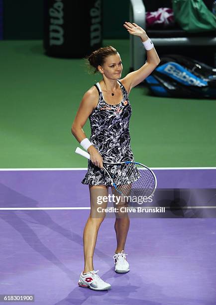 Agnieszka Radwanska of Poland celebrates victory in her singles match against Garbine Muguruza of Spain during day 4 of the BNP Paribas WTA Finals...