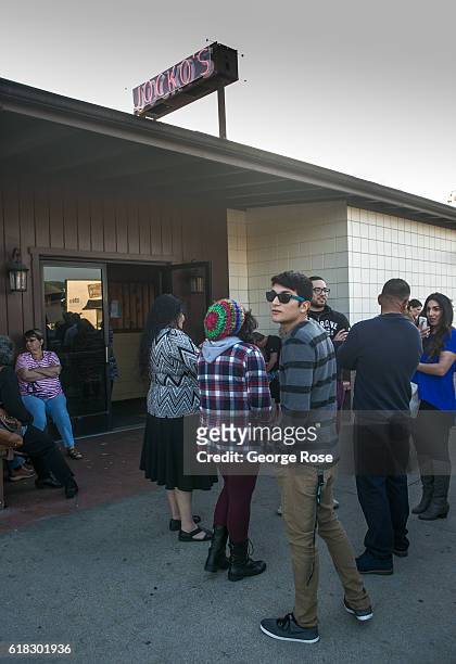 Crowd of people gathers outside the popular open flame BBQ restaurant Jocko's on April 13 in Nipomo, California. With its close proximity to Southern...