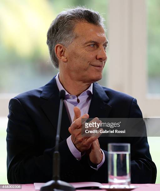 Mauricio Macri President of Argentina claps his hands during a press conference to announce the return of ANSES' social security funds to different...
