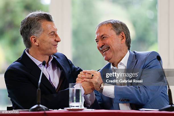 Mauricio Macri President of Argentina and Juan Schiaretti Governor of Cordoba shake hands during a press conference to announce the return of ANSES'...