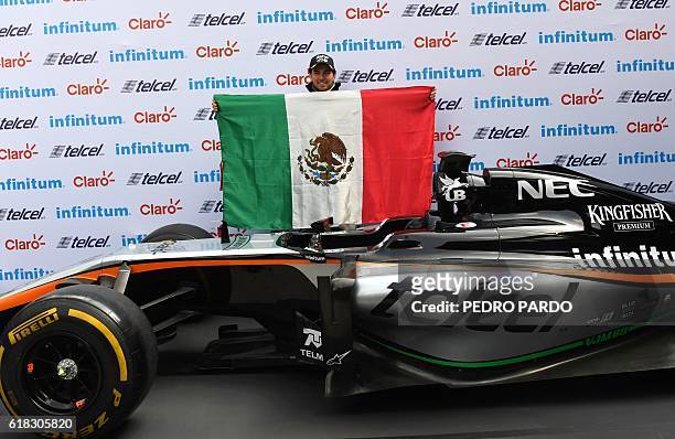 Sahara India Force Mexican driver Sergio "Checo" Perez poses for pictures after a press conference in Mexico City, on October 26, 2016. Mexico will...