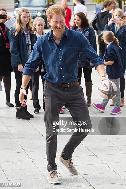 Prince Harry plays rugby with children as part of the Coach Core sporting apprenticeships at National Ice Centre on November 6, 2016 in Nottingham,...