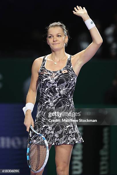 Agnieszka Radwanska of Poland celebrates victory in her singles match against Garbine Muguruza of Spain during day 4 of the BNP Paribas WTA Finals...