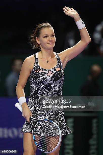 Agnieszka Radwanska of Poland celebrates victory in her singles match against Garbine Muguruza of Spain during day 4 of the BNP Paribas WTA Finals...