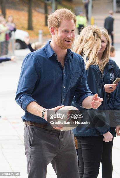 Prince Harry plays rugby with children as part of the Coach Core sporting apprenticeships at National Ice Centre on November 6, 2016 in Nottingham,...