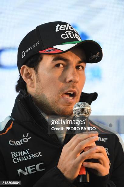 Sahara India Force Mexican driver Sergio "Checo" Perez speaks during a press conference in Mexico City, on October 26, 2016. - Mexico will hold its...