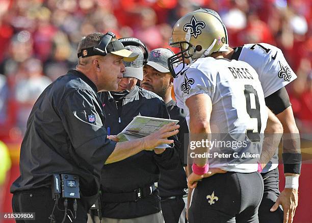 Head coach Sean Payton of the New Orleans Saints talks with quarterback Drew Brees against the Kansas City Chiefs during the second half on October...