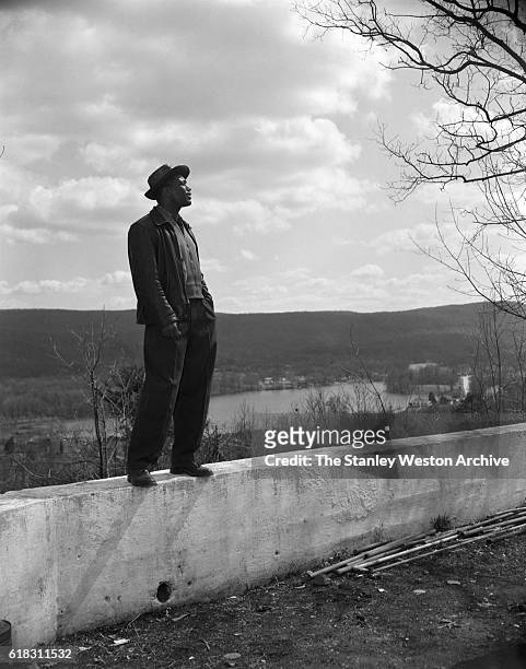 Sugar Ray Robinson, training for his bout with middleweight champion Gene Fullmer, takes a break and enjoys the view and sun at his training camp in...