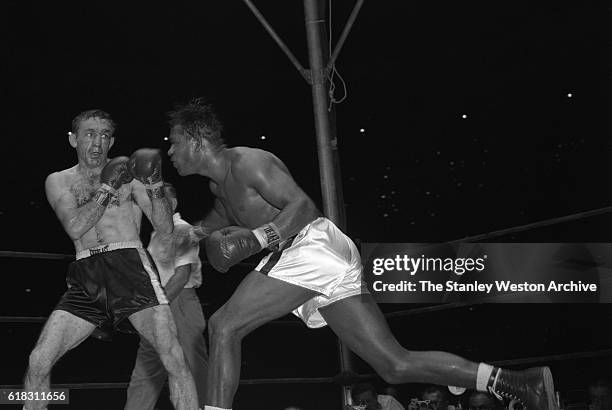 Carmen Basilio in a defensive stance as Sugar Ray Robinson throws a right. Carmen Basilio would go on to win the middleweight title in the 15 round...