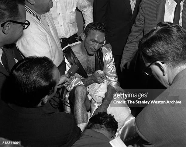 Carmen Basilio talking to the press after winning the middleweight title from Sugar Ray Robinson in Yankee Stadium, Bronx, New York on September 23,...