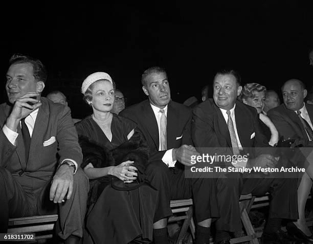Joe DiMaggio is one of the many spectators at the Carmen Basilio vs. Sugar Ray Robinson middleweight title fight in Bronx, New York, September 23,...