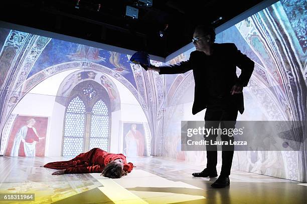 Actress Chiara Martini and Director of the Theatrical Academy in Florence Pietro Bartolini with a special helmet perform on stage during a rehearsal...