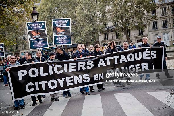 Police protest in the streets from Place de la Republique to the Saint Louis hospital for a 'marche de la colere' to the call of the union 'Unite SGP...