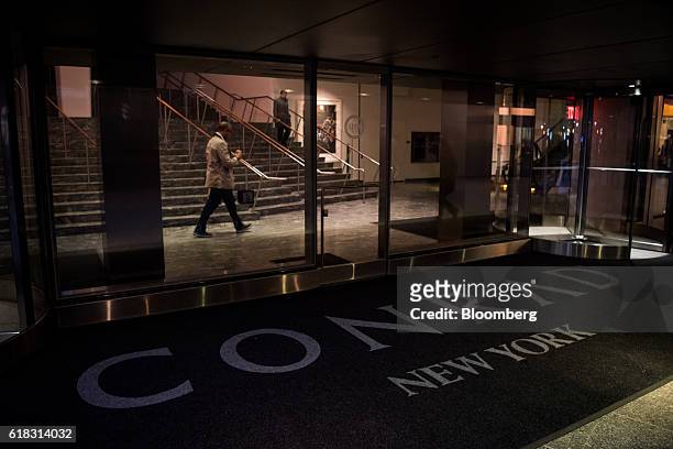 Guests walk inside the Hilton Worldwide Holdings Inc. Conrad hotel in New York, U.S., on Tuesday, Oct. 25, 2016. Hilton released earnings figures...