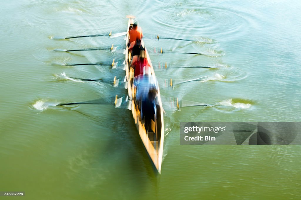 Teamwork Motion Blurred Rowers In Rowing Boat Training On River High ...
