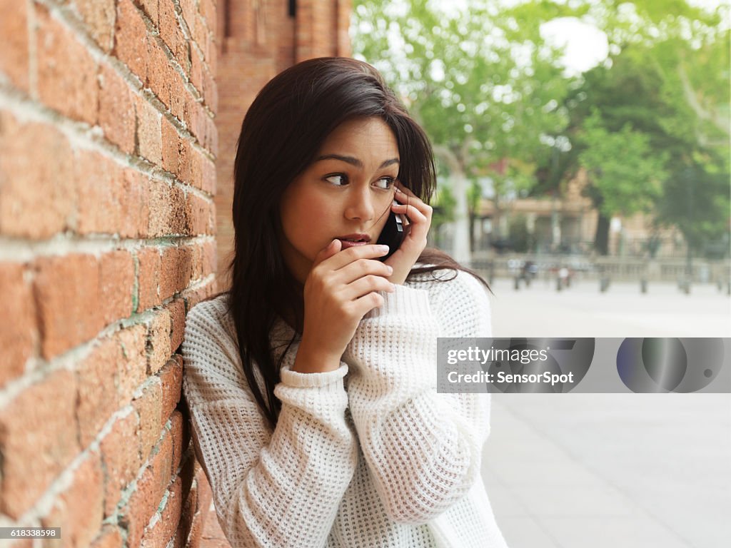 Beautiful woman talking using a smartphone