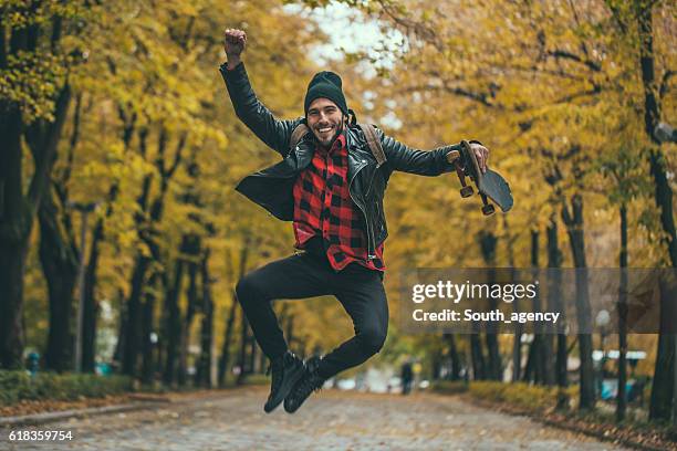 hipster having fun - men's field event stockfoto's en -beelden