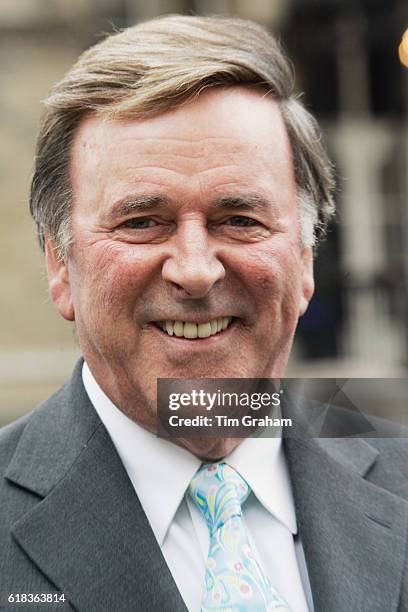 Radio presenter Terry Wogan awaits the arrival of Queen Elizabeth II outside BBC Broadcasting House to mark the 80th anniversary of the granting of...