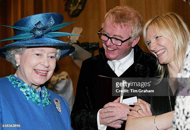 Queen Elizabeth II meets radio presenters Chris Evans and Jo Whiley during a visit to BBC Broadcasting House to mark the 80th anniversary of the...
