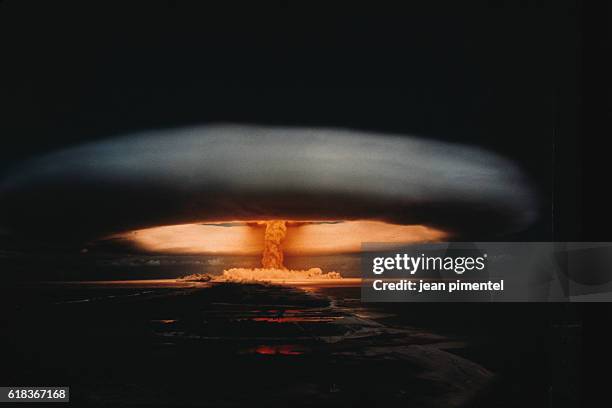 Nuclear explosion and atomic mushroom cloud. The image depicts a nuclear exercise in Mururoa. | Location: Mururoa, French Polynesia, France.