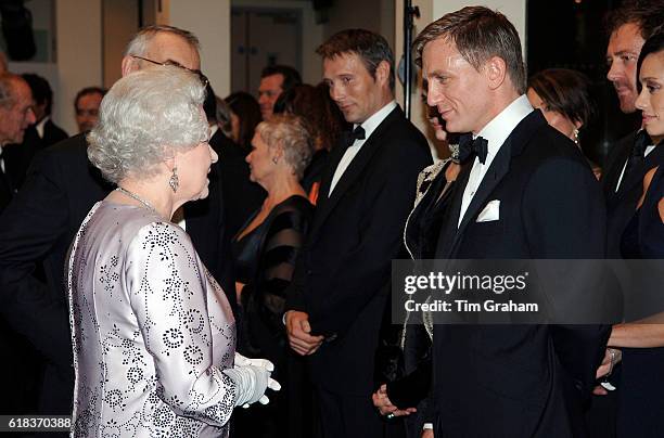 Queen Elizabeth II meets actor Daniel Craig at the premiere of the 21st Bond film 'Casino Royale' at the Odeon cinema in Leicester Square.