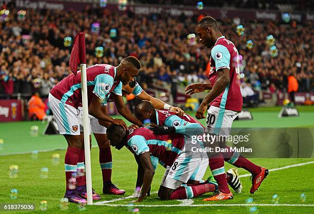 Cheikhou Kouyate of West Ham United celebrates scoring his sides first goal with his West Ham United team matesduring the EFL Cup fourth round match...