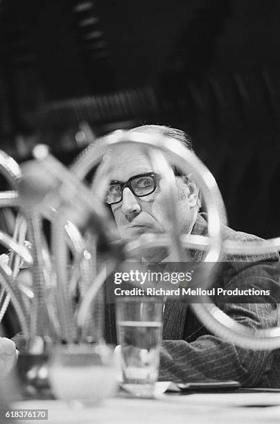 Francois Mitterrand, leader of the French Socialist Party, peers through cables while broadcasting at RTL radio station in Paris. Mitterrand served...