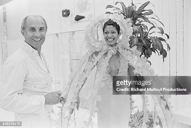 French fashion designer André Courrèges and one of his models share a laugh backstage at his 1975-1976 autumn-winter fashion show in Paris. Courrèges...