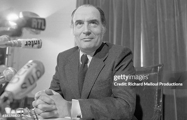 First Secretary of the French Socialist Party Francois Mitterrand sits with his hands folded in Paris.