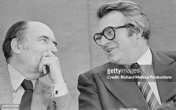 Leftist leaders Francois Mitterrand and Pierre Mauroy talk privately during the French Socialist Party's extraordinary congress in 1976. The Leftists...