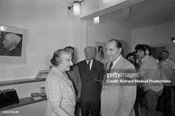 Israeli Prime Minister Golda Meir meets with French Socialist Party First Secretary Francois Mitterand on Mitterand's birthday. The meeting took...