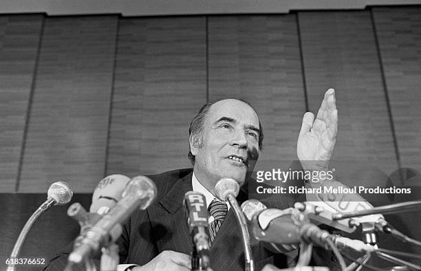 Secretary General of the French Socialist Party Francois Mitterrand gestures as he speaks during a press conference.