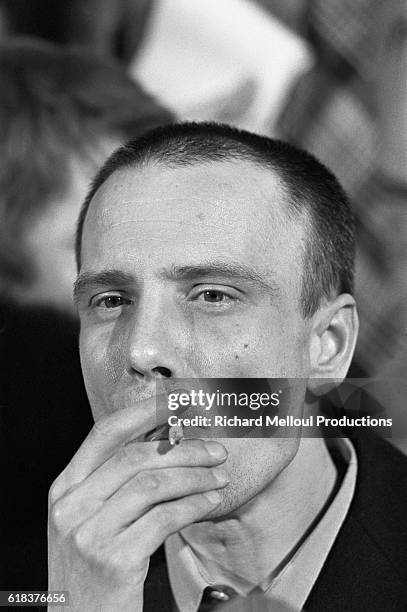 Soviet dissident writer and journalist Vladimir Bukovsky smokes a cigarette after being released at Zurich Airport. Jailed and sent to psychiatric...