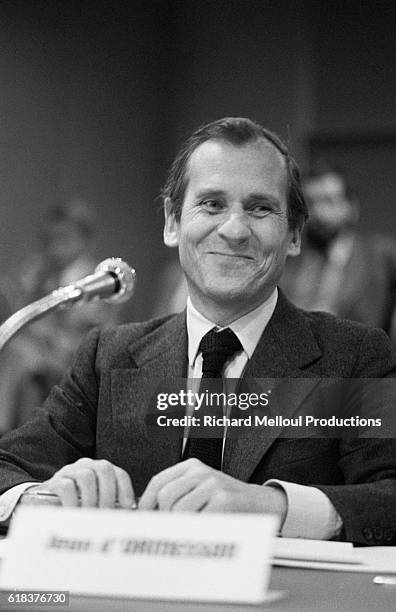 Writer and Academie Francaise member Jean d'Ormesson smiles as he sits at the microphone at the Europe 1 radio station. D'Ormesson took part in the...