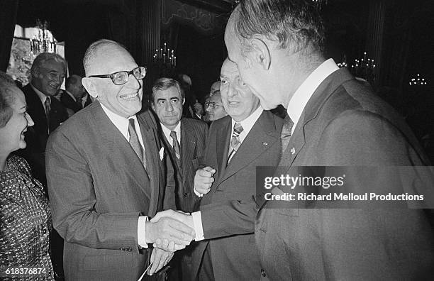 Former French Foreign Minister and journalist Maurice Schumann meets French President Valery Giscard d'Estaing at a garden party in honor of...