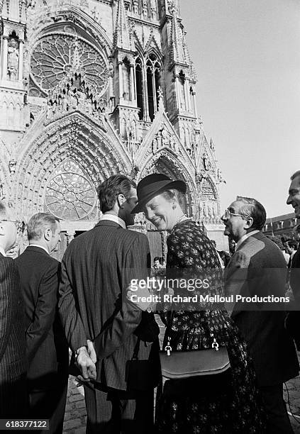 Queen Margrethe II of Denmark shares a laugh with her husband Prince Henrik. During the royal couple's trip to France, they visited Reims Cathedral...