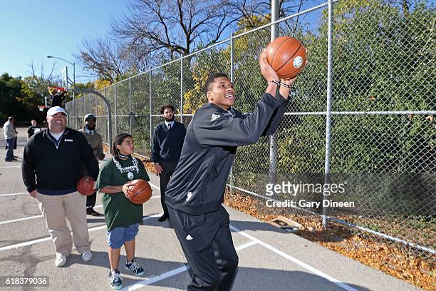 Giannis Antetokounmpo of the Milwaukee Bucks joins up with community groups and Precision Sports to refurbish outdoor public basketball courts at...