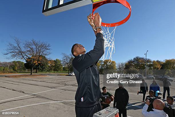 Giannis Antetokounmpo of the Milwaukee Bucks joins up with community groups and Precision Sports to refurbish outdoor public basketball courts at...