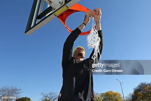 Michael Beasley of the Milwaukee Bucks joins up with community groups and Precision Sports to refurbish outdoor public basketball courts at Mitchell...