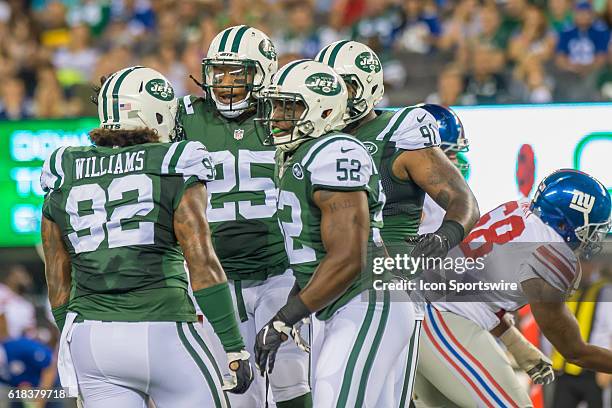 New York Jets players celebrate a nice defensive play during the NFL preseason game between the New York Giants and the New York Jets at MetLife...