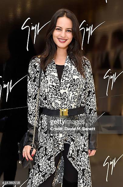 Guest attends the Giuseppe Zanotti London flagship store launch on October 26, 2016 in London, England.