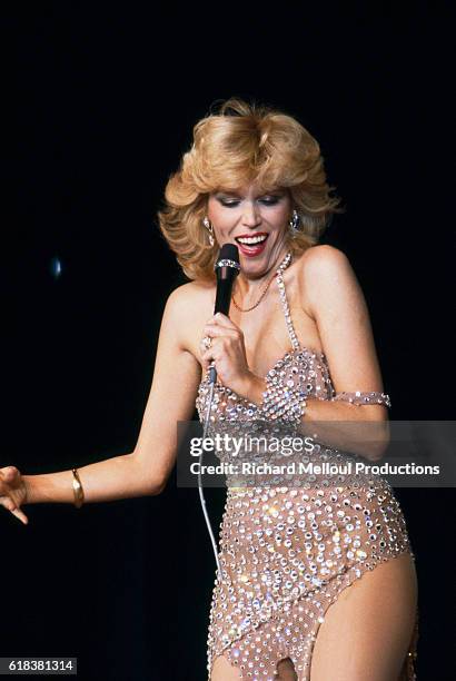 Amanda Lear performs at the Moulin Rouge on the occasion of the famous dance hall's 90th anniversary. Celebrities Jerry Lewis, Charles Aznavour,...