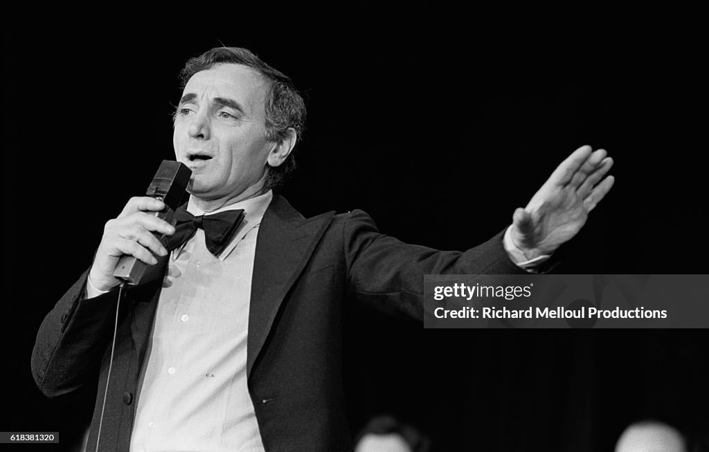Charles Aznavour Performs at the Moulin Rouge